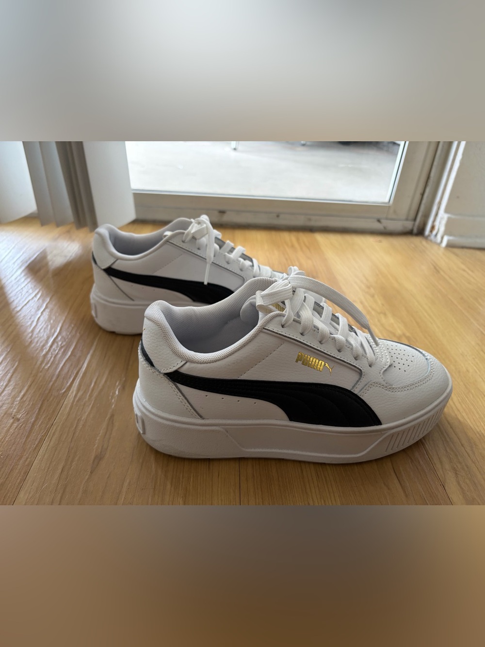 Women’s white and black Puma sneaker. Size 7
